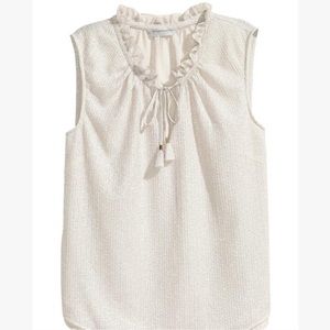 Sleeveless chiffon blouse with metallic pattern